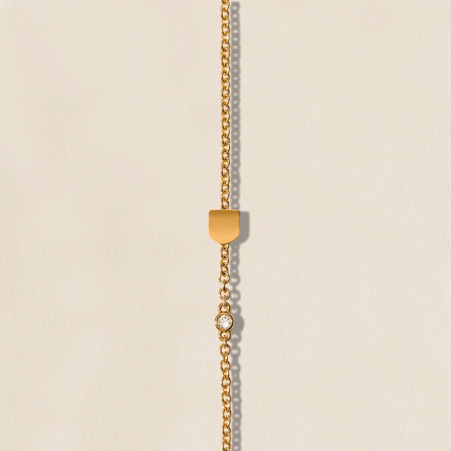 Golden Shield Bracelet on chain with diamond