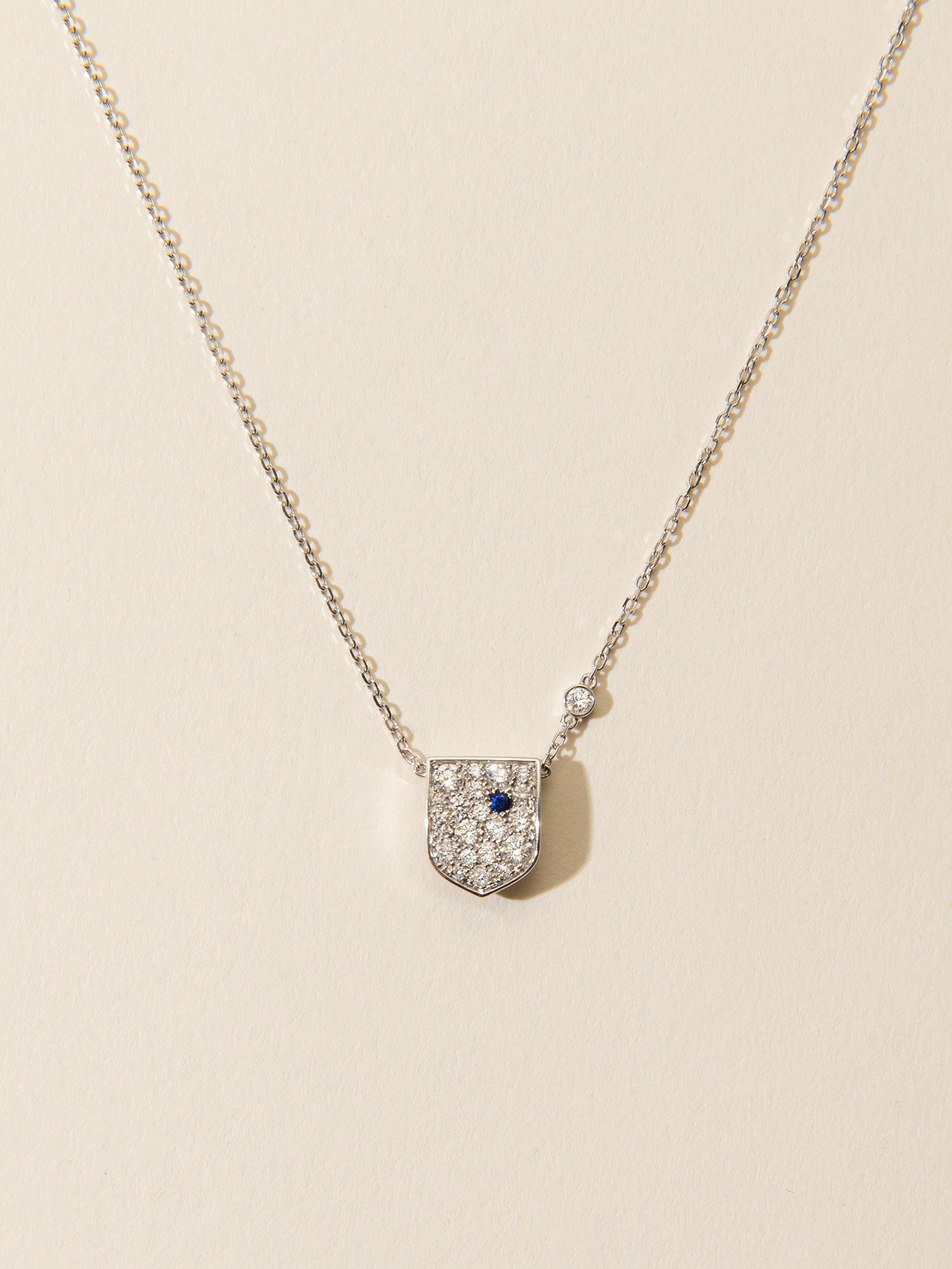 Personalised Golden Shield necklace paved with diamonds and sapphire